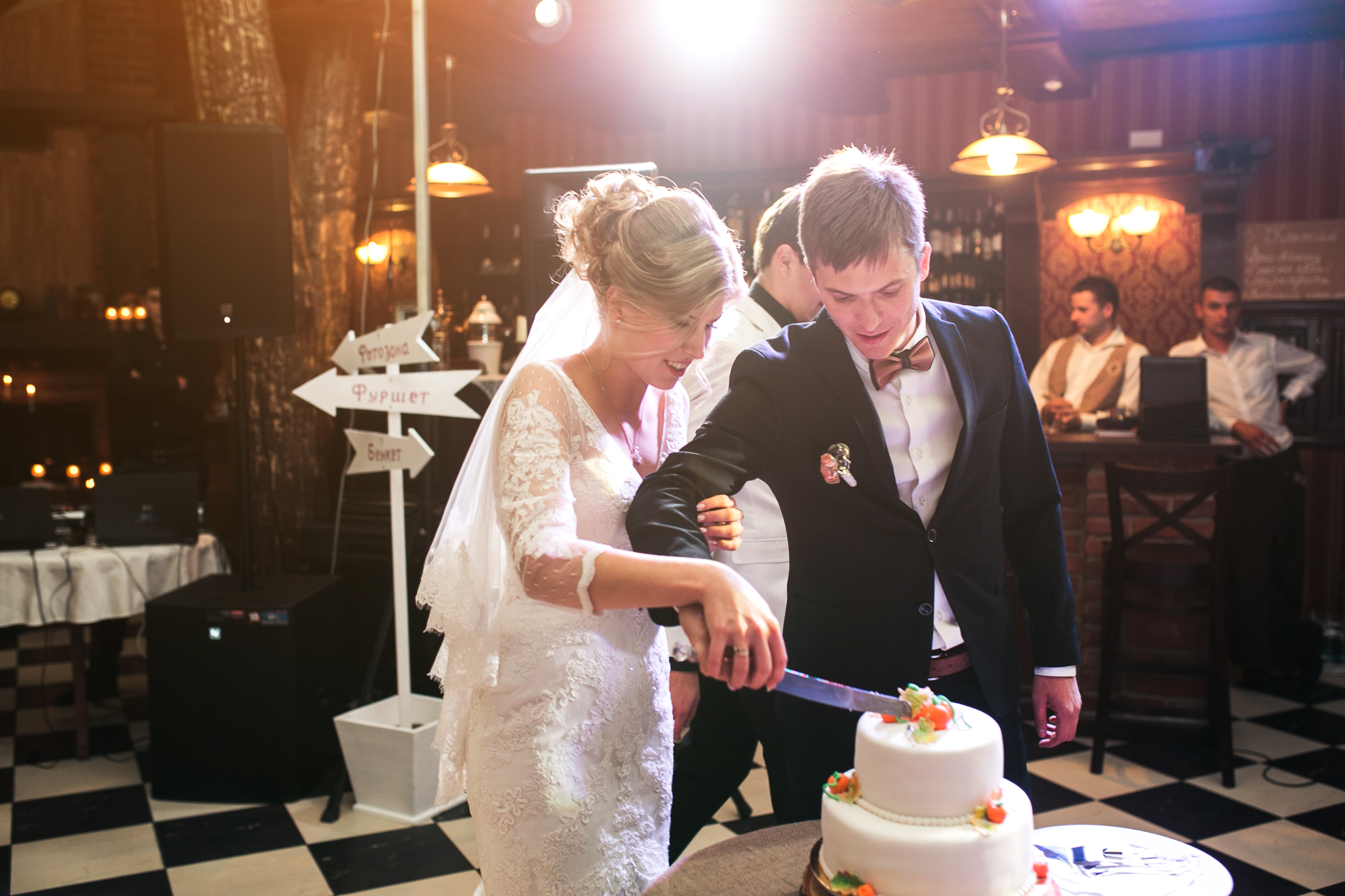 Newlyweds Cutting Cake